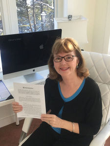 1. Elinor Florence -- at desk, with contract from Dundurn Press for new novel