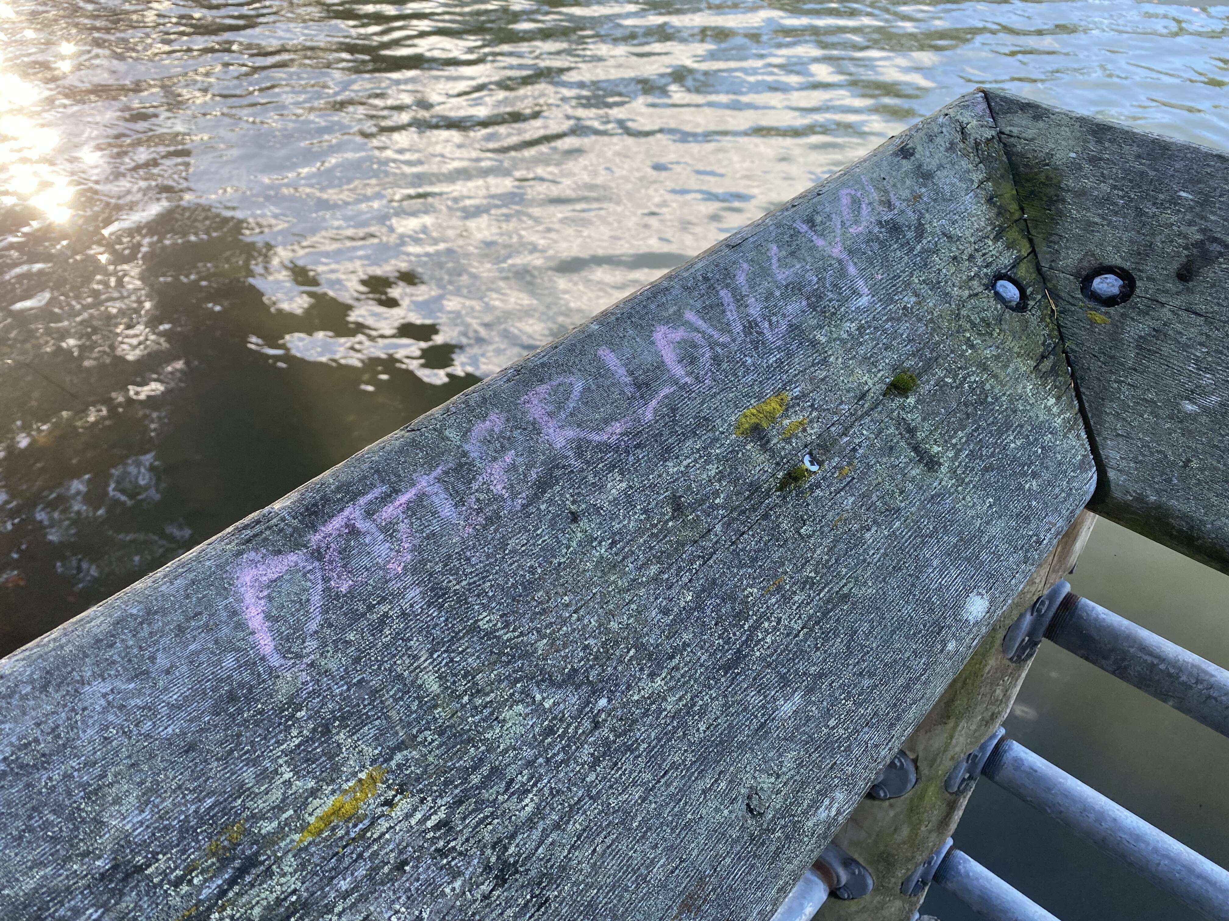 Graffiti on a ledge that reads "Otter loves you" along the Gorge Waterway in Saanich, Vancouver Island