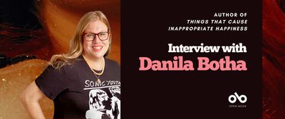Interview with Danila Botha banner. Photo of author centre-left, woman with long blonde hair smiling and standing with hand on hip while wearing glasses and a black Sonic Youth T-shirt. To the right a black section with text overlaid and the Open Book logo. Background of obscured section of the book cover showing the glitter covered neck and upper chest of a woman in a seductive pose. 