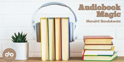 Audiobook Magic by Manahil Banduwala banner. Background image of small plant in white jar, books stood vertically with headphones around them, and another stack of books in a row on top of a wooden desk, against a white brick wall. Text overlaid at top right of banner and Open Book logo overlaid on pink circle at bottom left.