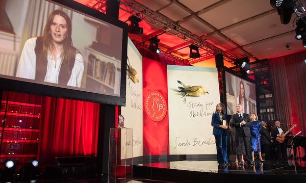 Sarah Bernstein pictured on a monitor at the Scotiabank Giller Prize gala, accepting her award virtually