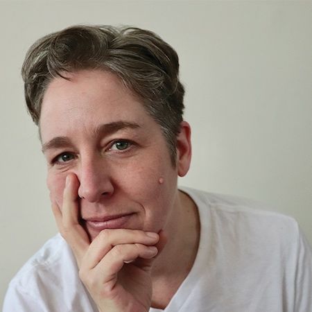 Author photo of Charlie Petch. Person with short, grayish-brown hair wearing a white shirt, resting their chin on their hand and looking at the camera with a gentle expression against a plain light background. Author photo of Charlie Petch. Person with short, grayish-brown hair wearing a white shirt, resting their chin on their hand and looking at the camera with a gentle expression against a plain light background.