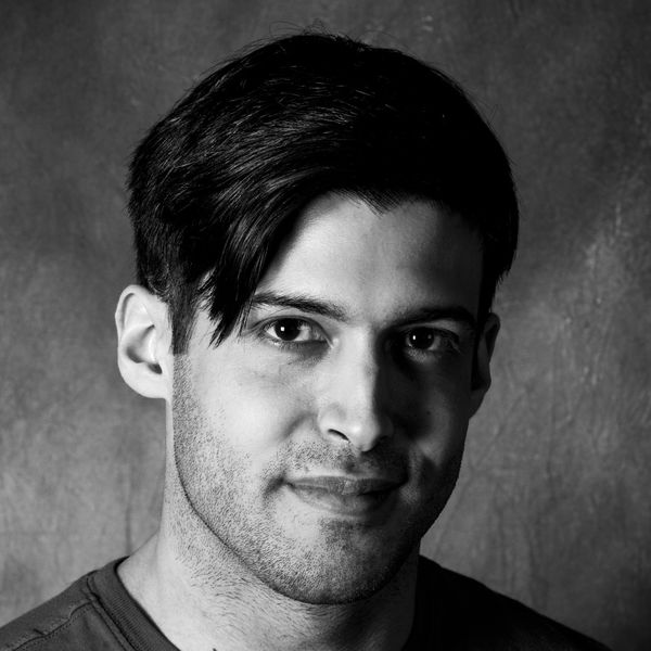 Black-and-white portrait of author Coltrane Seesequasis, showing a person with short dark hair and a calm expression, facing the camera against a textured gray background.