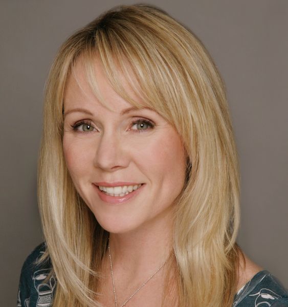 Author photo of Deborah Kerbel. A woman with long straight blonde hair smiles warmly at the camera. She is wearing a dark patterned top and a delicate necklace. The background is a plain gray, and the lighting is soft, highlighting her friendly expression. Author photo of Deborah Kerbel. A woman with long straight blonde hair smiles warmly at the camera. She is wearing a dark patterned top and a delicate necklace. The background is a plain gray, and the lighting is soft, highlighting her friendly expression.
