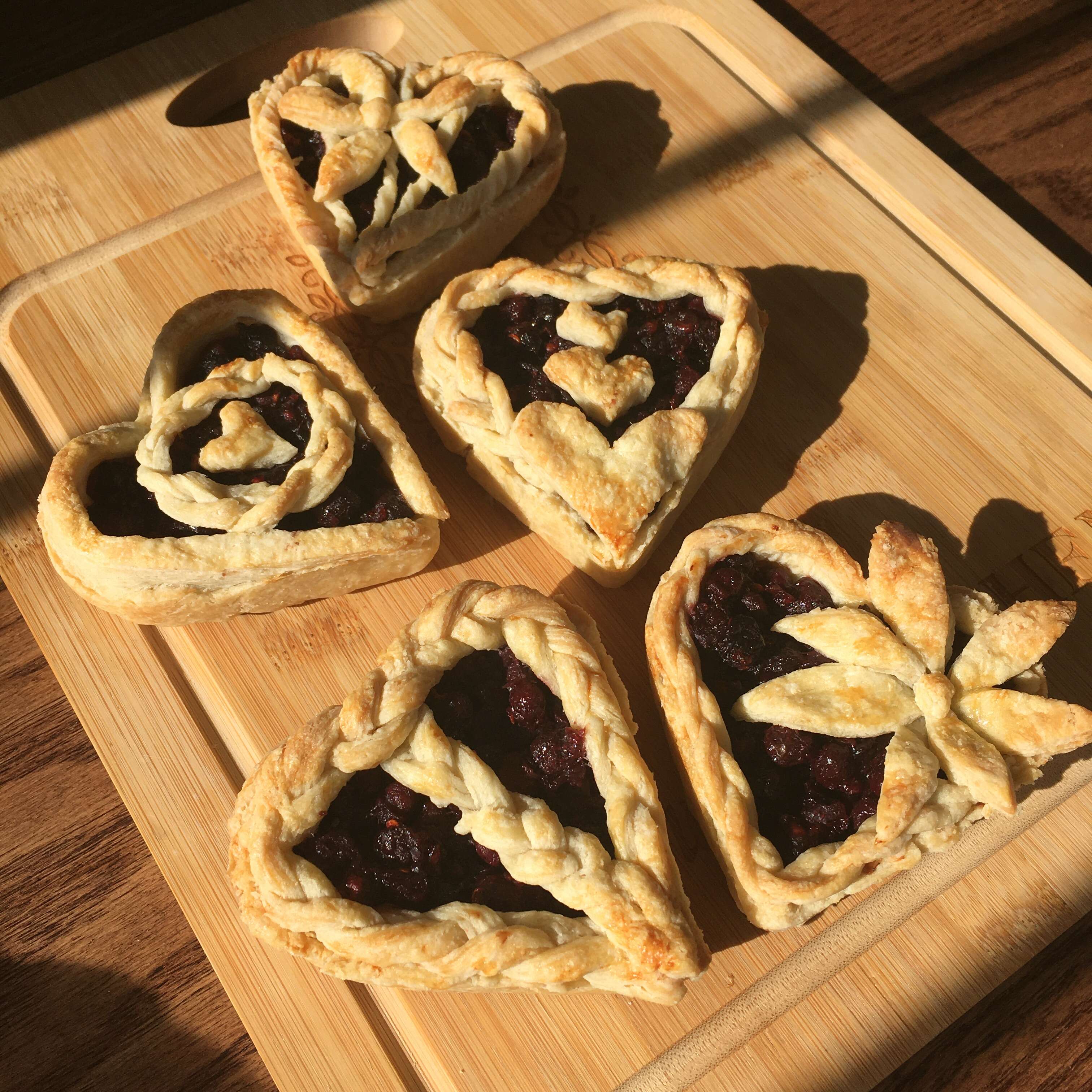 Heart-shaped pies made with saskatoonberries and cherries picked from neighbours' trees
