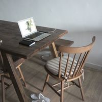 Table with a laptop and notebook