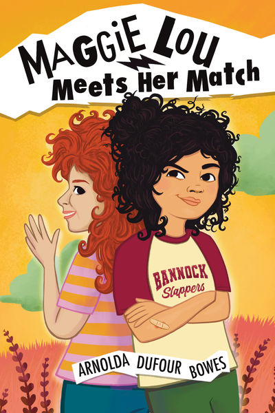 Illustrated cover of Maggie Lou Meets Her Match by Arnolda Dufour Bowes. Against a warm yellow and orange background, two girls stand back-to-back. On the left, a smiling girl with long curly red hair wears a striped pink and orange shirt. On the right, a girl with curly black hair crosses her arms confidently, wearing a cream and maroon baseball-style shirt that reads “Bannock Slappers.” The title appears in bold black letters above them, with a lightning bolt between the words "Maggie Lou" and "Meets Her Match."