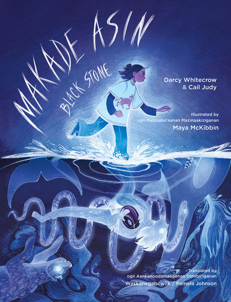 Book cover for Makade Asin / Black Stone by Darcy Whitecrow and Cail Judy, illustrated by Maya McKibbin. A young person in white and blue stands at the surface of a moonlit blue lake, splashing water as they move forward. Below the waterline, a glowing underwater world appears in shades of indigo and violet, with flowing animal and spirit-like forms, including a white bird. The design has a dreamy, layered look with handwritten title text and a strong blue-purple color palette.