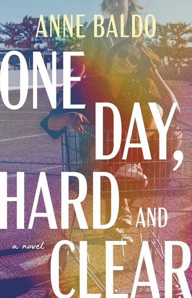 Book cover for One Day, Hard and Clear by Anne Baldo, showing a person standing with a shopping cart in a sunlit outdoor scene. The cover uses warm, hazy tones of pink, orange, gold, and purple, with large white and pale yellow typography layered over the image. The title appears in oversized stacked text, and “a novel” is printed in small script near the lower left. Book cover for One Day, Hard and Clear by Anne Baldo, showing a person standing with a shopping cart in a sunlit outdoor scene. The cover uses warm, hazy tones of pink, orange, gold, and purple, with large white and pale yellow typography layered over the image. The title appears in oversized stacked text, and “a novel” is printed in small script near the lower left.
