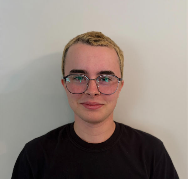 Head-and-shoulders author photo of Simon Casaubon, with short blond hair and glasses, wearing a black shirt against a plain light background. Head-and-shoulders author photo of Simon Casaubon, with short blond hair and glasses, wearing a black shirt against a plain light background.
