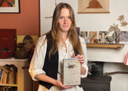 photo of author Sarah Bernstein holding her Giller winning book, Study for Obedience