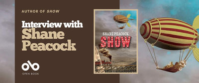 Interview with Shane Peacock, author of Show banner. Background image from cover of cloudy sky with illustrated old-timey blimp flying high and carrying characters below on a hammock tied to blimp by cables.  Full cover to centre-right of banner with pale border, with same image at top and illustrated coal-engine train running out of a mountain and across the landscape on a high, wooden bridge. Author name at centre, and title of book in stylized neon-lit red letters. Solid dark-red section to centre-left of banner with text and Open Book logo overlaid.