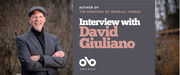 Banner featuring author David Giuliano standing outdoors in a striped suit jacket, black turtleneck, and cap, smiling with arms crossed. Text reads: "Author of The Upending of Wendall Forbes. Interview with David Giuliano." Open Book logo at the bottom.