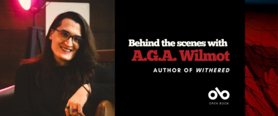 Banner image with author AGA Wilmot pictured on the left and text reading Behind the scenes with AGA Wilmot authored of Withered. Open Book logo bottom right.