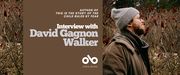 Interview with David Gagnon Walker, author of THIS IS THE STORY OF THE CHILD RULED BY FEAR banner. Background image of a dense grassland in winter with the author standing to the right amidst naked shrubs and tall grasses with a pine forest beyond. Man with thick brown beard and glasses, wearing a toque and brown winter jacket, staring to the right and out of view at the wilderness around him. Solid red-brown section to centre left of banner with text and Open Book logo overlaid.