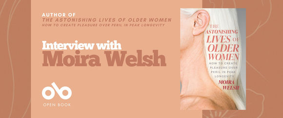 A promotional banner with a peach background featuring the book The Astonishing Lives of Older Women: How to Create Pleasure Over Peril in Peak Longevity by Moira Welsh. The right side shows the book cover with a close-up of an older woman’s face and white hair. On the left, white and brown text reads: “Author of The Astonishing Lives of Older Women — Interview with Moira Welsh.” The Open Book logo appears at the bottom left.