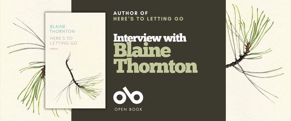 Book banner on a cream background with pine branch illustrations on both sides and a dark olive center panel. A small image of the book cover, “Here’s to Letting Go,” appears on the left. In the center, text reads “Author of Here’s to Letting Go” above the large headline “Interview with Blaine Thornton,” with the Open Book logo below.
