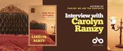 Interview with Carolyn Ramzy, author of Taslim: We Are the Prophets banner. Background image from cover of warmly lit bedroom with antique, adorned bed and lamp on side table, with religious image framed on wall above. Full cover of book with border to centre-left, with same image and text overlaid. Solid dark red section to centre-right of banner with text and Open Book logo overlaid.