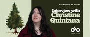 Book banner featuring author Christine Quintana. She is shown from the shoulders up, wearing a deep red coat and looking slightly upward with a soft smile. To her left is a watercolor illustration of a tall evergreen tree on a pale green background. The right side of the banner has dark green text reading “Interview with Christine Quintana” and smaller text above it that says “Author of As Above.” The Open Book logo appears at the bottom right.