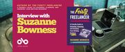 Interview with Suzanne Bowness, author of THE FEISTY FREELANCER banner. Background photo of home office with white brick walls and wooden desk table, MacBook and photo and various documents on table, along with coffee mug. Solid dark pink section to centre left with text and Open Book logo overlaid. Cover image of book to centre right of banner.