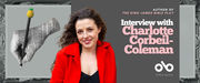 Wide promotional banner for The King James Bible Play featuring author Charlotte Corbeil-Coleman. The banner has a monochrome ornamental floral background with framed gray panels. On the left, a black-and-white illustration shows a hand holding a rolled sheet printed with Bible text and a dark pen-like object tipped with a yellow textured shape. In the centre, Charlotte Corbeil-Coleman smiles at the camera, wearing a bright red coat over a black top. On the right, white and pink text reads “AUTHOR OF THE KING JAMES BIBLE PLAY” and “Interview with Charlotte Corbeil-Coleman,” above the Open Book logo.