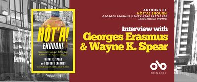 Interview with Wayne K. Spear and Georges Erasmus, authors of Hòt'a! Enough!: Georges Erasmus's Fifty-Year Battle for Indigenous Rights banner. Background image from cover, black and white photo of housing block with various buildings and a concrete and grass courtyard with sparse trees. Solid red section to centre right of banner with text and Open Book logo overlaid. Image of book cover to centre left, with the aforementioned image of the urban neighbourhood and the author, Georges Erasmus, standing with back to camera in foreground and looking out toward buildings, man with thick, grey hair and wearing a rugged, beige, brushed leather jacket in a traditional style.