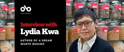 Banner image with photo of author Lydia Kwa standing in front jars of dry goods in a Chinese grocery store. Text reads Interview with Lydia Kwa author of A Dream Wants Waking. open Book logo top left.