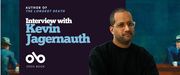 Banner for an interview with Kevin Jagernauth, author of The Longest Death. The design features his portrait on the right against a dark teal background, a painterly book-scene on the left, and the Open Book logo below the title.