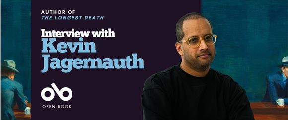 Banner for an interview with Kevin Jagernauth, author of The Longest Death. The design features his portrait on the right against a dark teal background, a painterly book-scene on the left, and the Open Book logo below the title.
