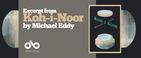 Promotional banner for Koh-i-Noor by Michael Eddy. The design is set against a dark charcoal background with a horizontal layout. On the left, white and tan serif type reads "Excerpt from / Koh-i-Noor / by Michael Eddy" in a stacked arrangement. Below the text is a white line-art icon of an open book with the label "OPEN BOOK" in small caps. To the right, the full book cover appears in a thin gold frame, showing the two golden vessels and luminous interior landscape. Flanking the composition on both edges are cropped circular details from the cover's misty landscape scene, rendered in soft blues, golds, and atmospheric haze. The banner balances promotional clarity with visual intrigue, inviting the viewer to explore an excerpt while reinforcing the book's evocative aesthetic. The palette is cohesive—charcoal, cream, gold, and muted pastels—and the layout guides the eye from text to icon to cover in a clean, left-to-right flow.