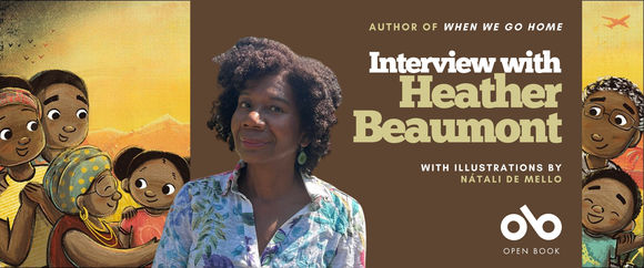 romotional banner featuring author Heather Beaumont centered against a brown background, wearing a floral blouse and smiling at the camera. The text reads "Author of WHEN WE GO HOME" at the top, "Interview with Heather Beaumont" in large white and cream lettering in the center, and "with illustrations by Nátali de Mello" below. The Open Book logo appears in the bottom right corner. On either side of the author photo are illustrated characters from the book cover showing joyful Black family members against a golden yellow sunset background, with a small orange bird silhouette in the upper right.
