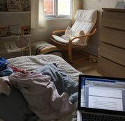 Small baby sleeping next to an open laptop / Photo by Lindsay Zier-Vogel