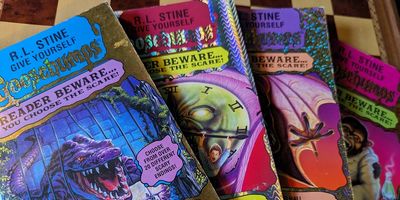 Four volumes of R.L. Stine's Give Yourself Goosebumps, fanned out.