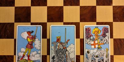 A three-card tarot spread: the Page of Swords, the Queen of Swords, and Judgement.